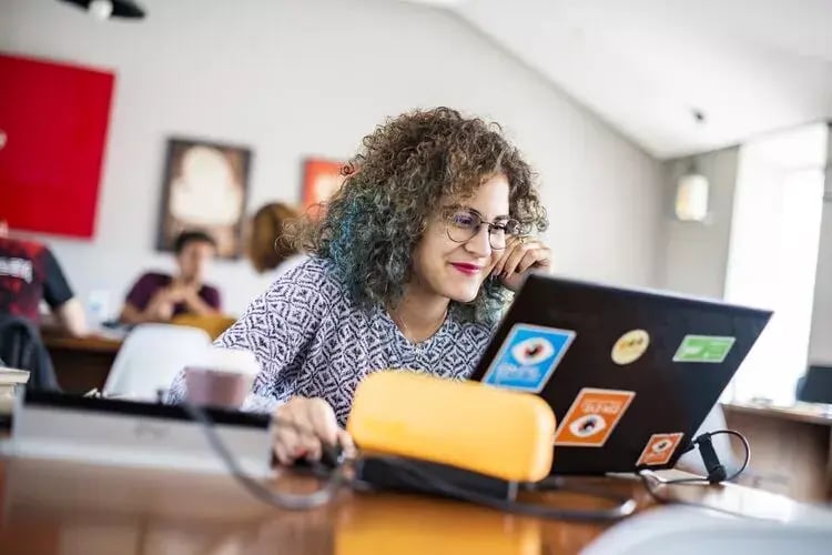 Image of a teacher using a laptop Image of a teacher using a laptop